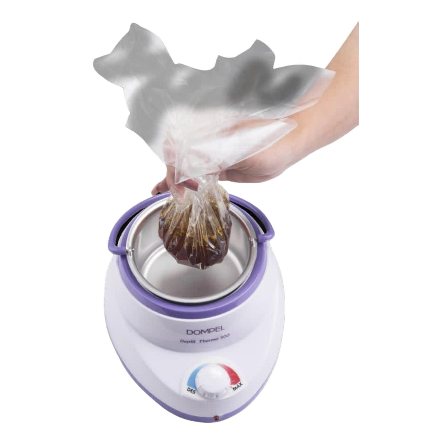 Hand inserting a plastic bag of wax into a Dompel wax warmer, preparing for the waxing process.